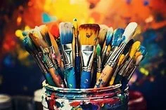 Cups of paint brushes