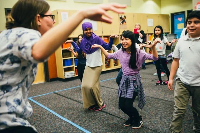 Students dancing in a school gym
